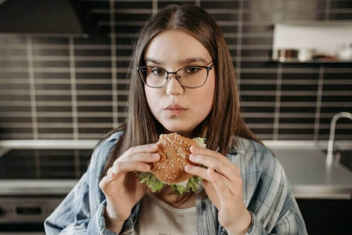 Woman eating a burger